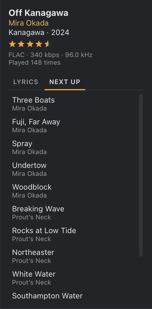 The Now Playing panel’s Next Up tab, listing the next ten tracks with their artists